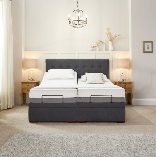 Gray and white mattress set in a bedroom with decorative elements.