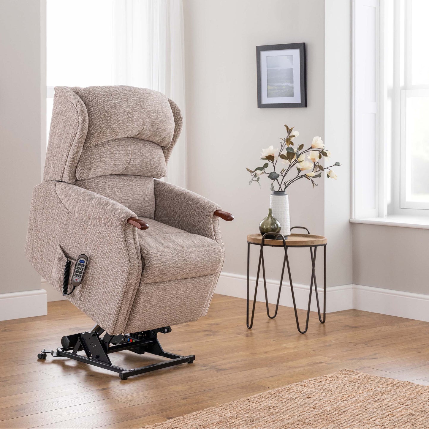 Beige celebrity westbury lift chair in a room with a side table and decorative elements.