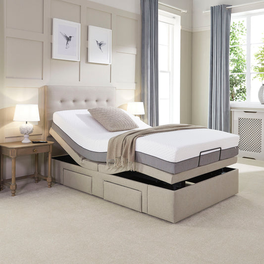 Beige adjustable bed in a bedroom setting with side tables and lamps.