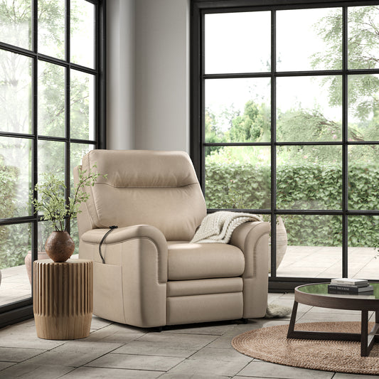 Beige recliner chair in a modern living room with large windows.