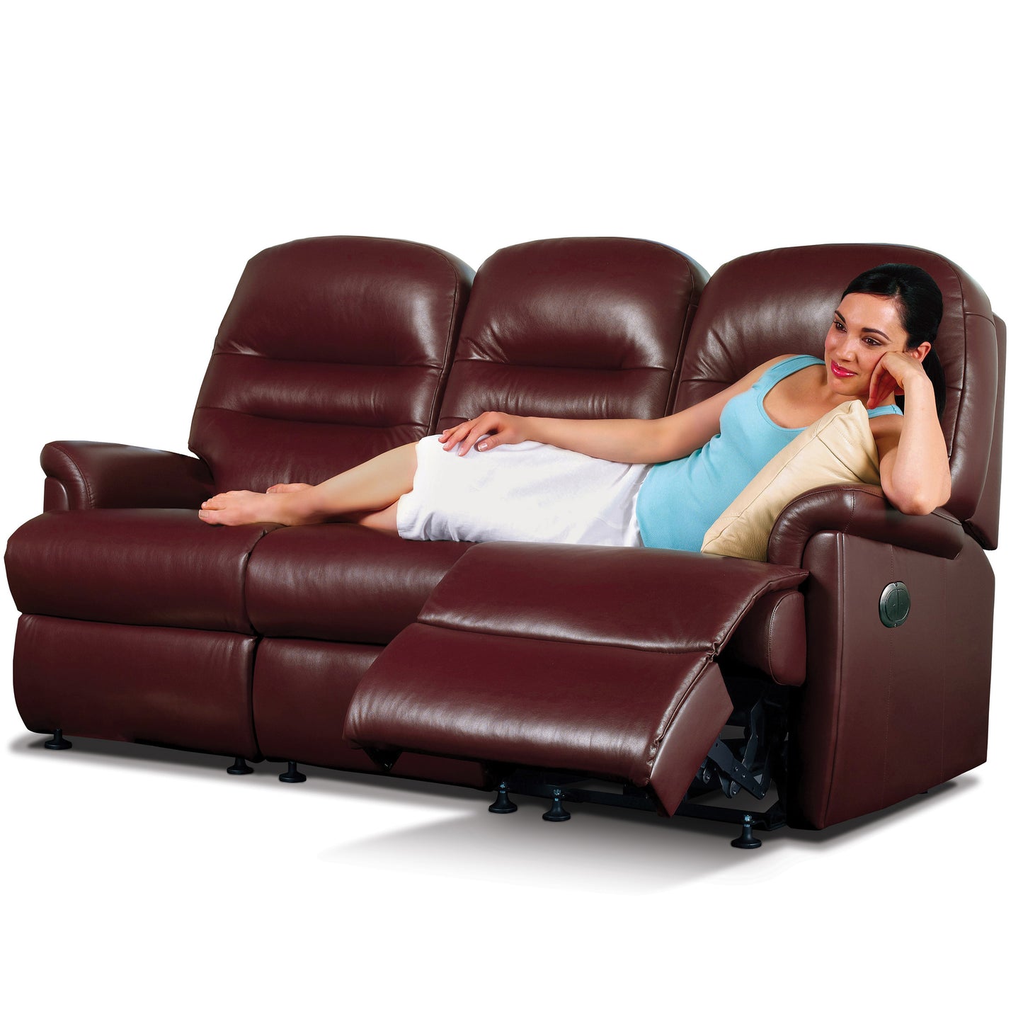 Woman relaxing on a brown leather Sherborne Keswick recliner sofa against a white background