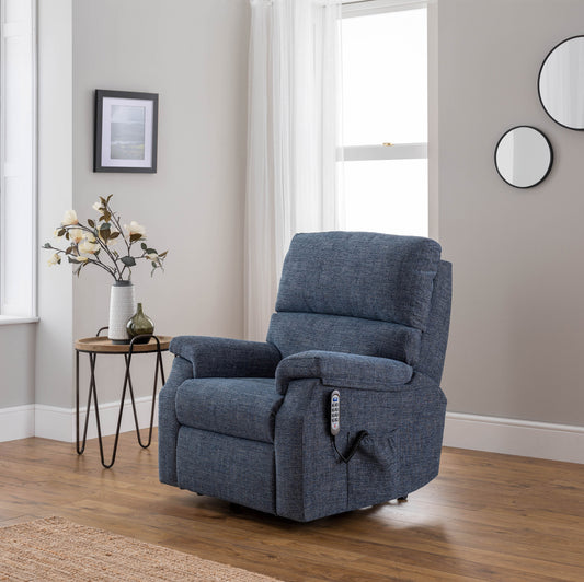 Blue celebrity newstead recliner chair in a living room setting with a side table and decor.