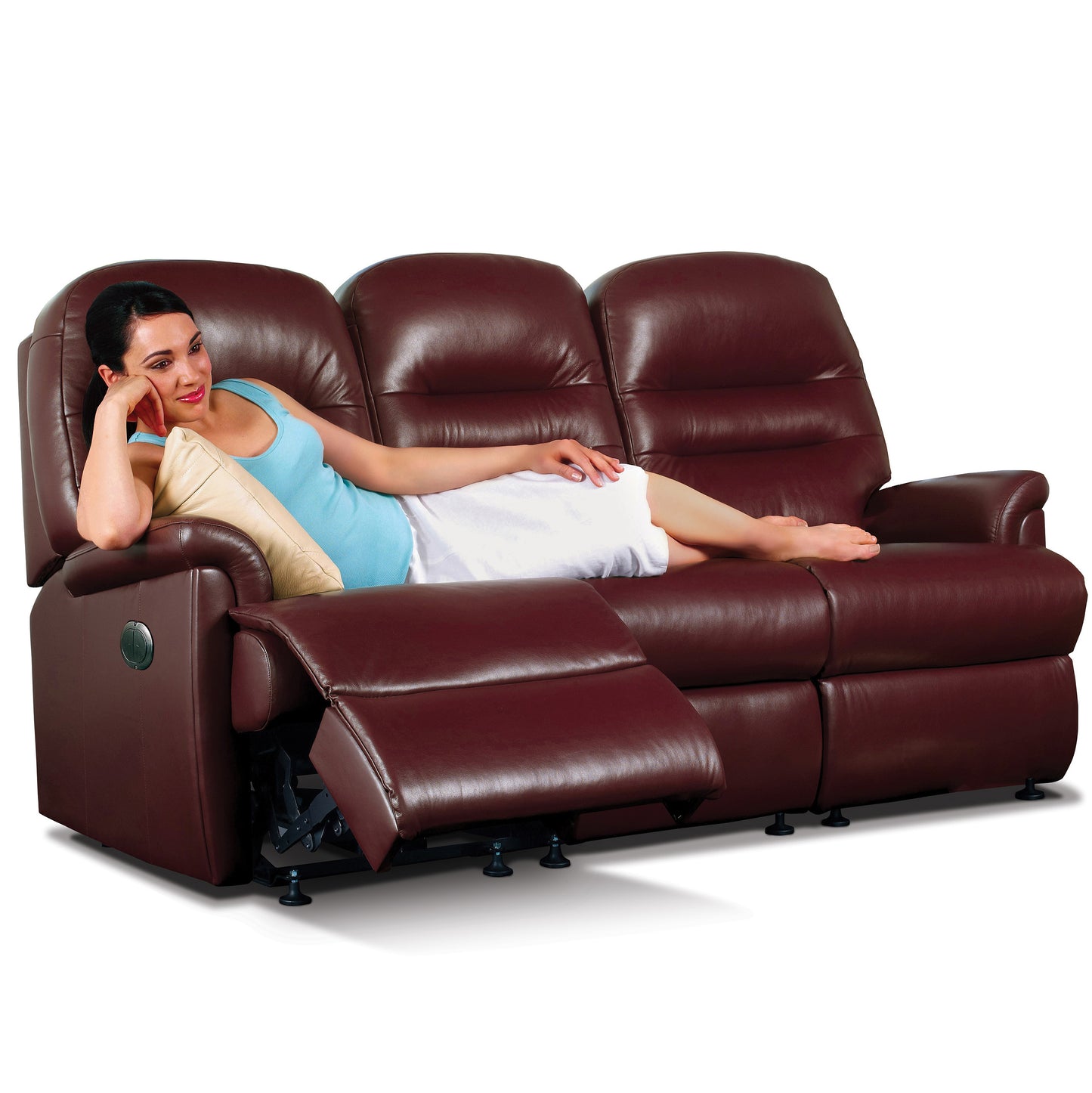 Woman relaxing on a brown leather Sherborne Keswick recliner sofa against a white background